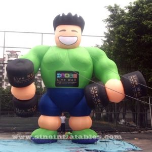 homme de muscle de fitness gonflable géant vert